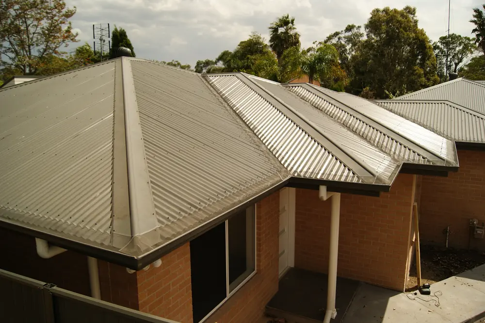 Brick homes with Leaf Free gutter guard fitted along the full gutter run of each roof